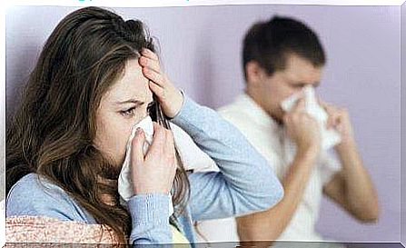 Husbands and wives blow their nose because they are sick and need garlic remedies.