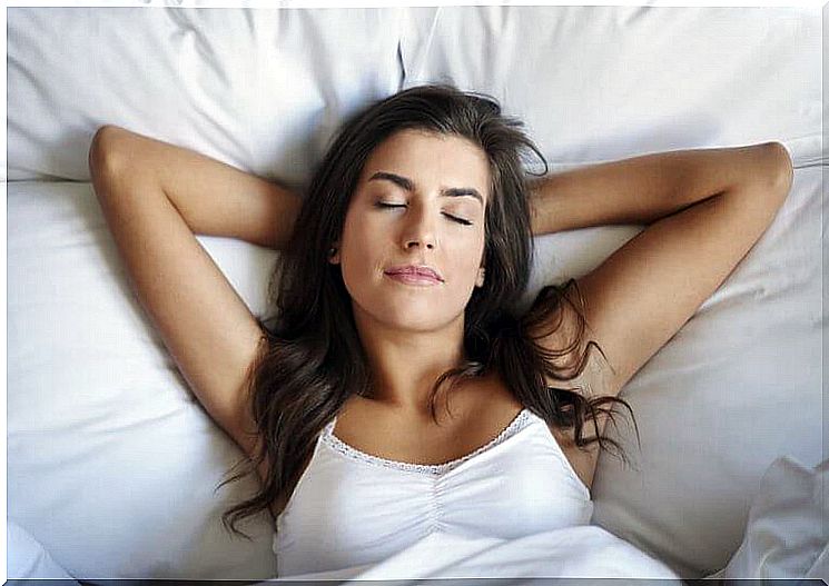 A woman sleeps contentedly in her bed.  She knows our tips from neurobiology.