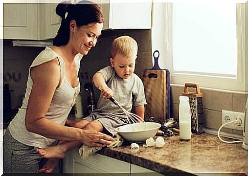 Mother with child in kitchen