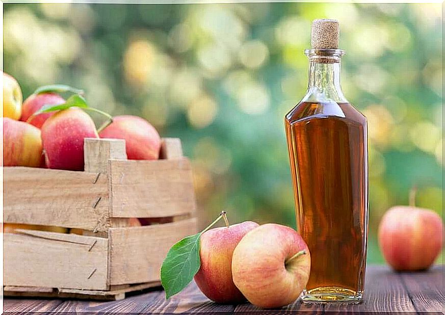 Facial cleansing with apple cider vinegar - bottle and apples