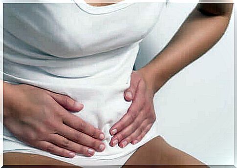 health benefits of bananas - woman with abdominal cramps