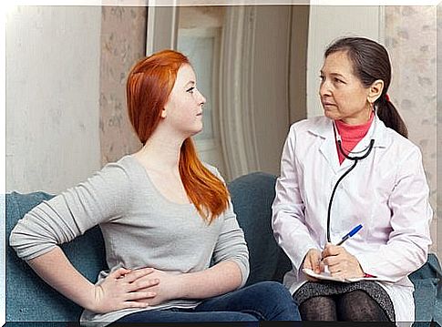 Woman with appendicitis at the doctor's