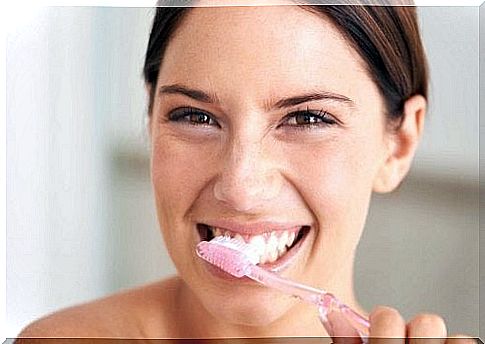 Woman brushing teeth