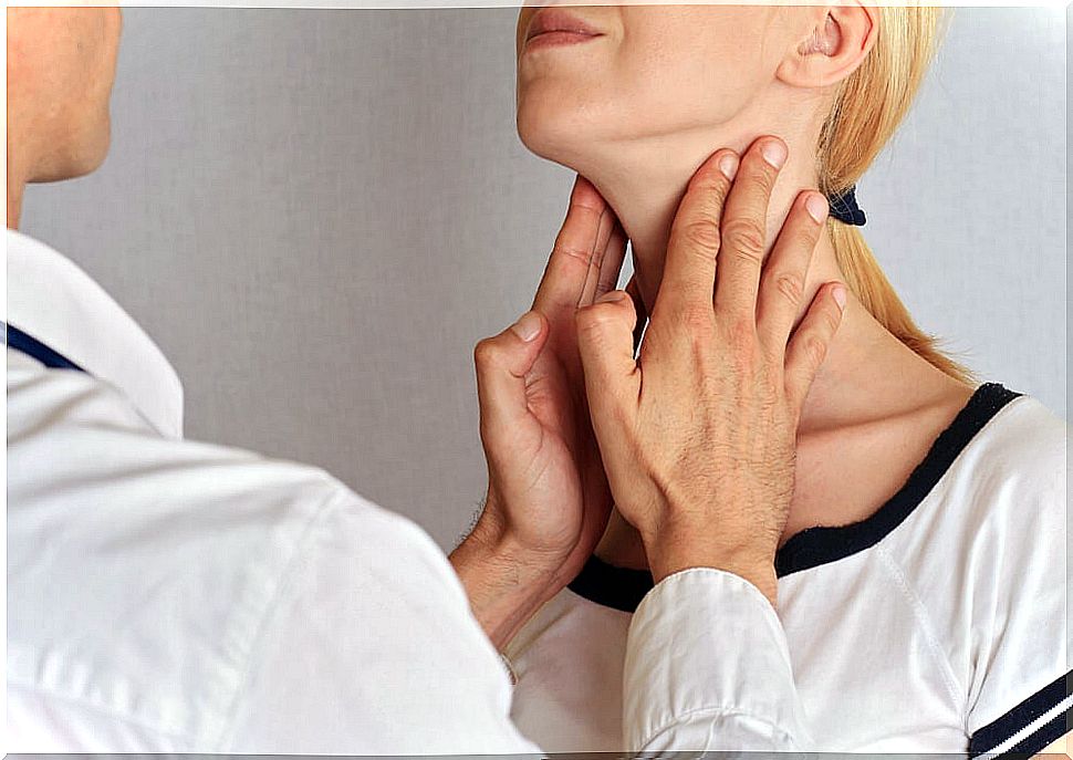 Doctor explains to woman the physiology of the thyroid gland and hormone production 